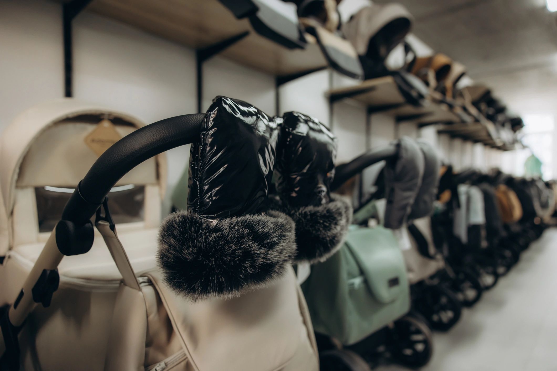 Row of baby strollers in a showroom